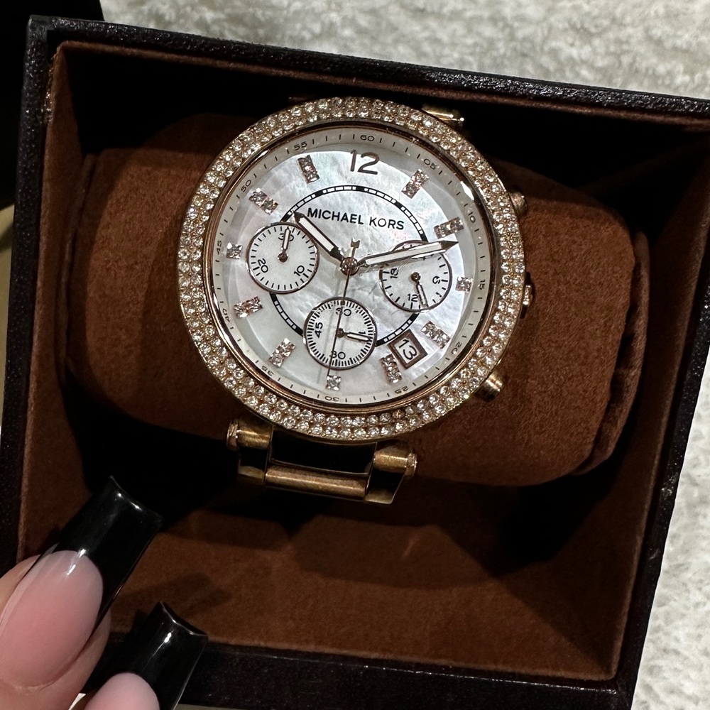 Gold woman’s Michael kors watch